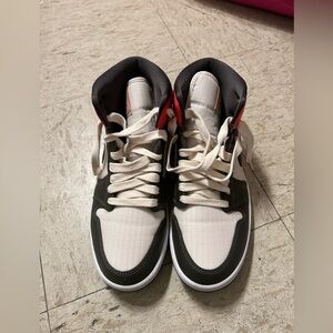 Black and cream high top shoes